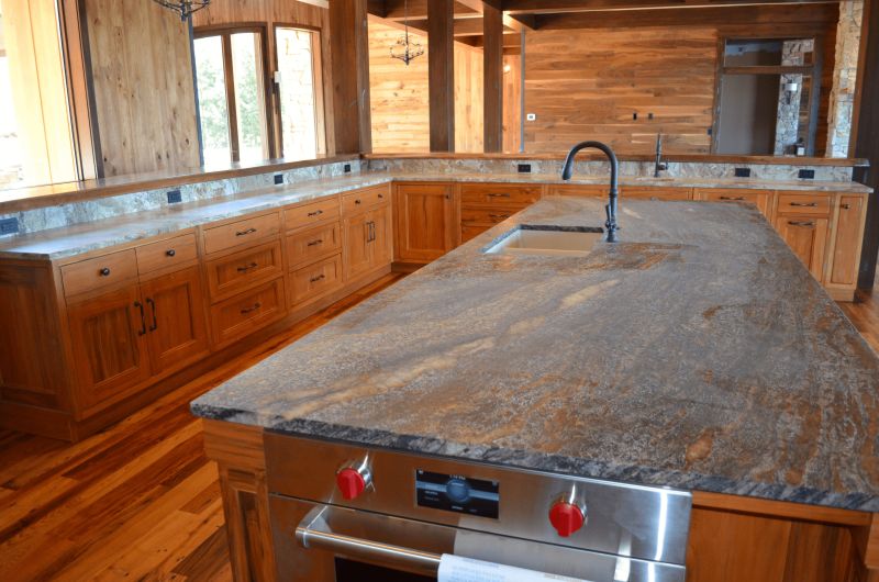 Kitchen island with a stone top and range