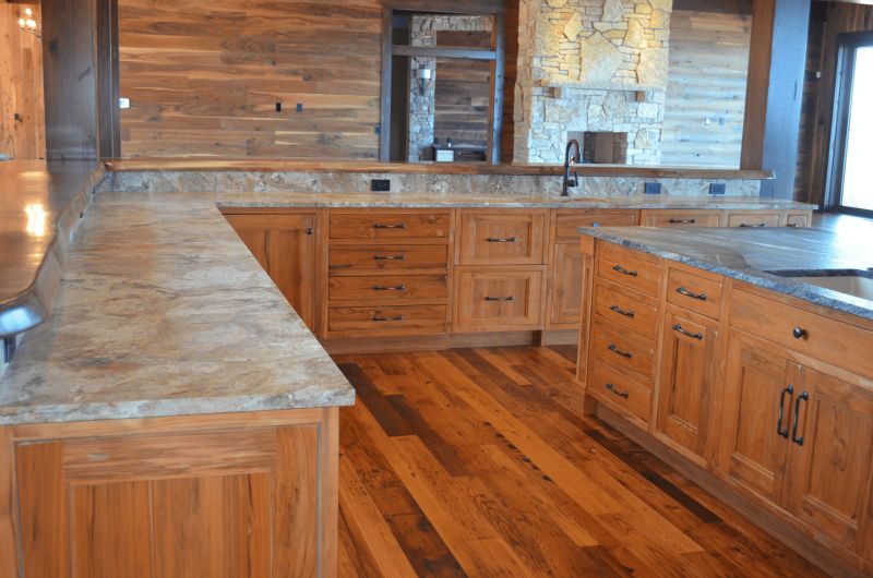 L-shaped kitchen with stone countertops